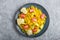 Fried pomelo with tomatoes and avocado on gray concrete background. Top view