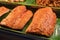 Fried pork cutlet on banana leaves in the street food market of Thailand, Thai food asian style