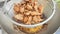 Fried pork in grid basket hanging to drying