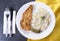 Fried pork meat with salad with knife and fork