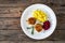 Fried pork meatballs with mashed potatoes and grated beets on wooden table