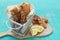 Fried pork rinds, in a metal basket on a blue background. Copy space. Typical kitchen concept