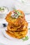 Fried potato pancake with dip of radishes cream cheese and chives