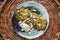 Fried potato pancakes on the old ceramic plate served over wicker basket.