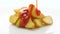 Fried potato wedges with ketchup on white background