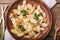 Fried potatoes with parsley and onion in an earthenware dish