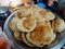 Fried Puri in a frying pan. very popular street food in India.famous indian food, Selective focus on subject