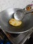 Fried Puri in a frying pan. very popular street food in India.famous indian food, Selective focus on subject