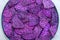 Fried purple sweet dragon fruit chips as snacks, close up, asian food