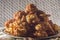 fried rice balls called bolinhos de arroz on a plate with copy space and striped background