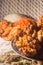 fried rice balls called bolinhos de arroz  on a plate with copy space and striped background, bowl with artos beans in the