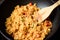 Fried rice with minced pork and tomato cooking in pan