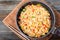 Fried rice with vegetables and pork in a cooking pan