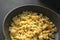 fried or rosted cauliflower in a frying pan on a wooden cut board, vegeterian breakfasts