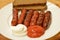 Fried sausages with ketchup bread and mayonnais