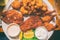 Fried seafood platter top view of local dish from Key West, Florida, Conch fritters, cod fish in oily batter fry