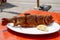 Fried and seasoned trout at a fishing festival on a white plate