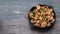 Fried shrimp close-up in creamy sauce in a cast iron pan on the left column free space