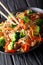 Fried soba noodles with mushrooms, broccoli, carrots, peppers cl