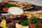 .Fried souvlaki with greek salad, potatoes and tzatziki sauce in plate