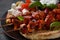 Fried souvlaki, greek salad and tzatziki on wooden table.