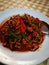 Fried spicy eel. Hot and spicy stir - fried ell in plate on the