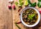 Fried spicy eel with Thai spices.On wooden background.Copy space