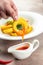 Fried squid rings breaded served with sweet chili sauce. Fried calamari squid appetizer, food recipe background. Close up