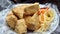 Fried stinky tofu with pickle vegetable and sauce on the side