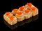 Fried Sushi Uramaki roll with sauce and tobiko caviar on top isolated on black background with reflection