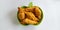 Fried sweet banana or pisang moleng in plate on white background.