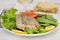 Fried swordfish with salad