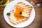 Fried toast with apricot jam in a plate