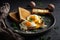 Fried Toast bread with four different types of cooked chicken eggs. AI generated