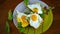 Fried toast with cheese spread of arugula and fried egg in a plate