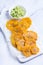 Fried tostones, green plantains, bananas with guacamole sauce