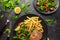 Fried Tuna Steaks on Black Plate with Fresh Green, Tomato Salad, lemon and french fries. healthy sea food