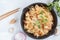 Fried vegan rice noodles with tofu and vegetables