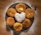 Fried yeast dough donuts on a wooden table