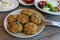 Fried zucchini balls plate in the greek tavern.