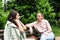 Friend comforting a stressed friend. Two woman young females talking in te park after divorce and abandon abusive husband. Support