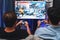 Friend gamers playing video game of battle martial arts fighter. Sellable.