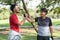 Friend of greeting morning with holding hands after running exercise. Two man athletic friends greeting each other with arm