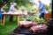 friend grilling ribeye steak at garden party