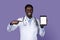 Friendly african american doctor holding digital tablet with white screen