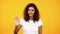 Friendly afro-american female showing palm, waving hand on camera, welcoming