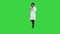 Friendly asian doctor woman working with documents and new pills on a Green Screen, Chroma Key