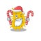 Friendly bacteria spirilla in Santa Cartoon character holds Christmas candies