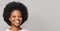 Friendly cheerful attractive curly-haired young woman smiling pleasant, having fun, enjoying. Closeup studio portrait