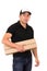 Friendly confident delivery man carrying boxes